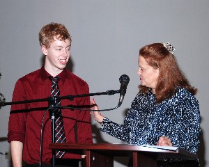 Charles Stewart receives the Julia O'Brian scholarship from Dr. Jo Wildermuth in May.